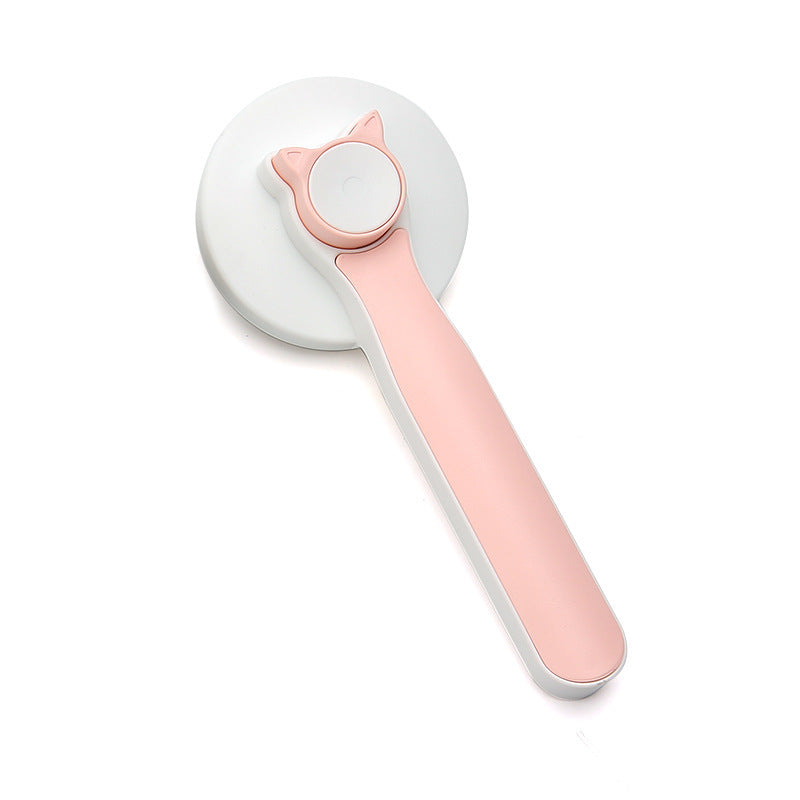 Pink self-cleaning pet grooming brush